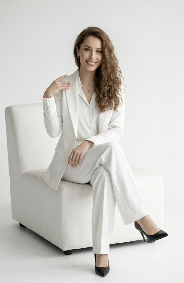 A full-length studio portrait of a confident, smiling wom... thumbnail 2