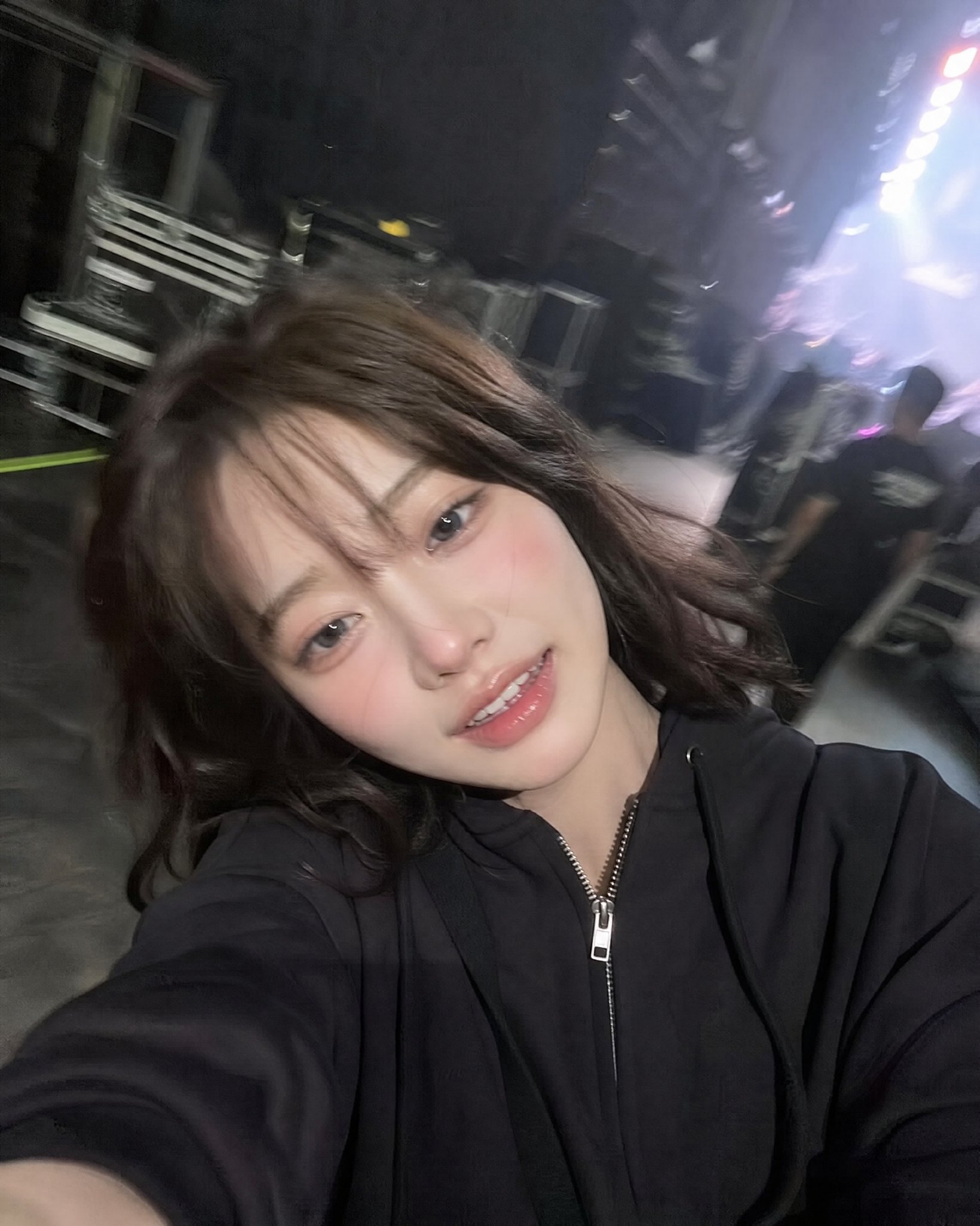 Candid Backstage Selfie with Tired Smile