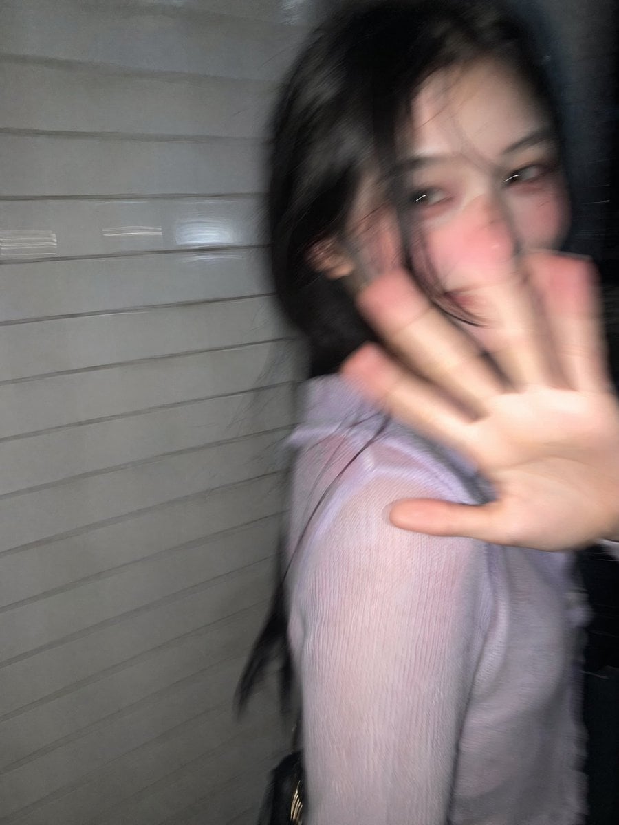 Candid Nighttime Tokyo Snapshot of Surprised Woman