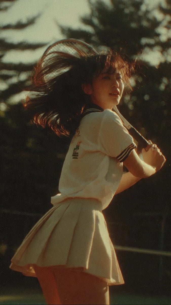 Japanese Teen in Tennis Mid-Swing, 90s Film Aesthetic image 1
